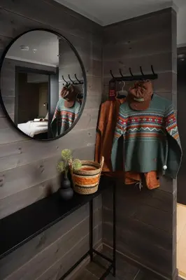 a mirror on a wall in a room at Riddergaarden Hotel & Mountain Lodge, Beitostølen in Beitostøl