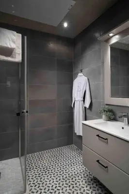 a bathroom with a shower and a sink and a mirror at Riddergaarden Hotel & Mountain Lodge, Beitostølen in Beitostøl