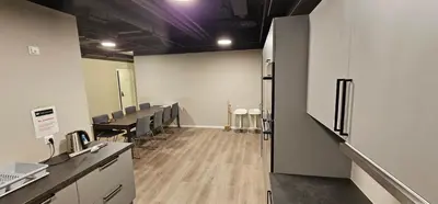 a room with a conference room with tables and chairs at Lilleby Apartment in Trondheim