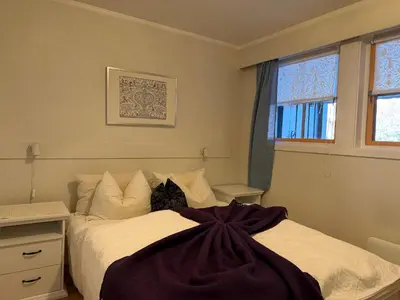a bedroom with a bed and a window at 2-Bedroom Apartment With Balcony & Fireplace! in Beitostøl