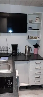a kitchen with a sink and a counter top at Hos Jurate in Fagernes