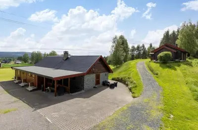 a small house on a hill with a pathway at Skogcamping in Bjørnstad