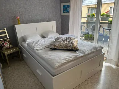 a bed with a pillow on it in a bedroom at Fjordgata i Trondheim in Trondheim