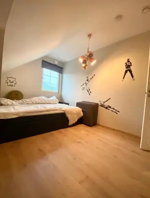 a bedroom with a bed and a ceiling at Hus i Stryn in Stryn