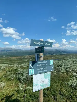 a sign on the top of a mountain at Steinstølen by Norgesbooking - cabin with a lovery view in Hol
