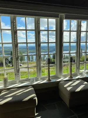 a large window with a view of the ocean at Cozy family cabin with stunning location on Golsfjellet in Golsfjellet