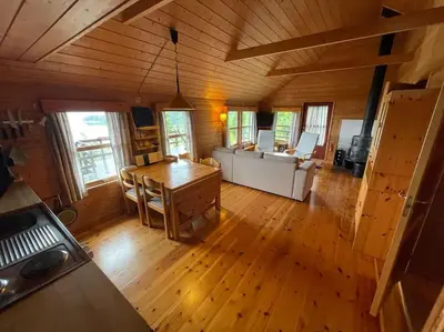 an overhead view of a kitchen and living room in a cabin at Cozy cabin, minimum 5 nights in Oppheim