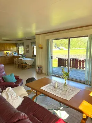 a living room with a couch and a table at Villa Soltun in Ringebu