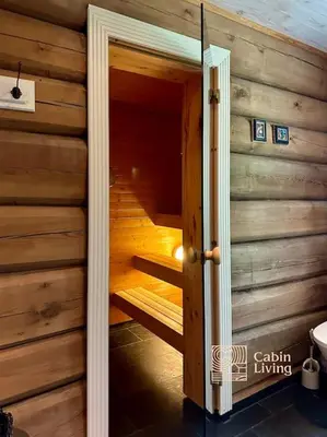a wooden room with a sauna in a house at Large log cabin at Sjusjøen with sauna, fireplace and panoramic view in Ringsaker