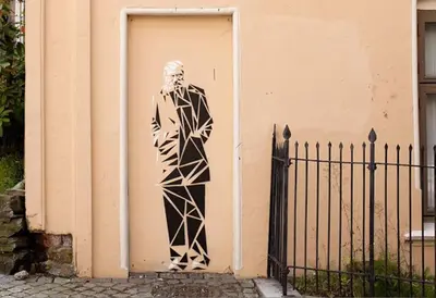 a statue of a man standing in a door at Spacious historical art oasis in the city center in Bergen