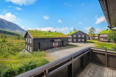 a house with a grass roof on top of it at Gaustatoppen View Apartment in Gaustablikk