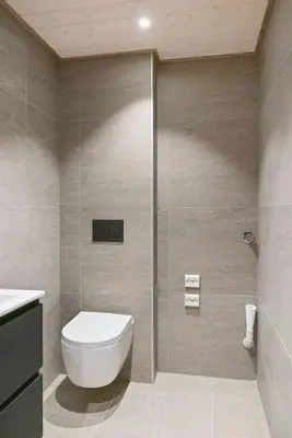 a bathroom with a toilet and a shower at Mountain View Apartment - penthouse in Stranda