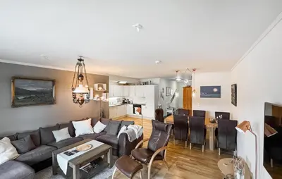 a living room with a couch and a table at Stunning Apartment In Tyinkrysset in Tyinkrysset