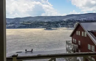 two people are standing on a frozen lake at Stunning Apartment In Tyinkrysset in Tyinkrysset