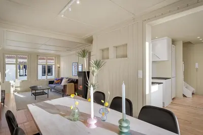 a dining room and living room with a table and chairs at The Townhouse Dream I Must See Views! in Bergen