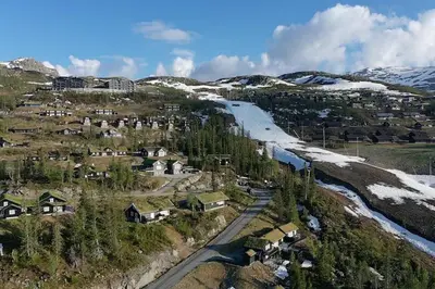 an aerial view of a town with a train at Lägenhet med utsikt mot Gaustatoppen, ski in ski out in Gaustablikk