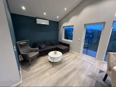 a living room with a couch and a table at Luxury apartment Bergen in Bergen