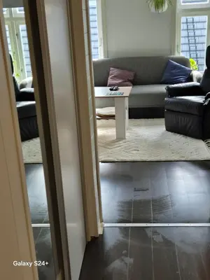 a living room with a couch and a table at APARTAMENT Duże mieszkanie W centrum Ålesund in Ålesund