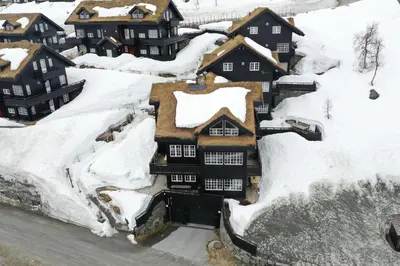 an aerial view of a house covered in snow at Cozy Ski-In Ski-Out Apartment on Geilo, Stunning Views! in Geilo