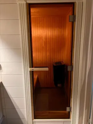 a door to a room with a wooden wall at Ullsheim Grendehytte in Beitostøl