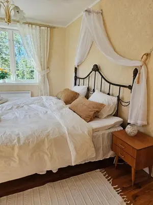 a bedroom with a large bed with a canopy at Familie og gruppevennlig hus 12 senger 240kvm in Oppdal