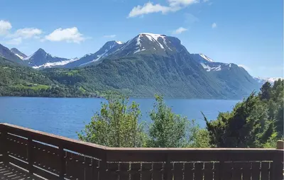 a view of a lake in front of a mountain at Stunning Home In Lauvstad With House Sea View in Lauvstad