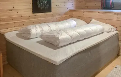 a large mattress sitting on top of a room at Stunning Home In Lauvstad With House Sea View in Lauvstad