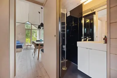 a kitchen with a sink and a counter top at Tiny Mountain Cabin II in Stranda