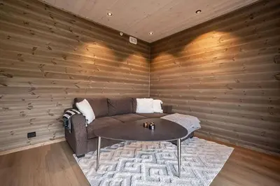 a living room with a couch and a table at Mountain View Apartment - 205 in Stranda