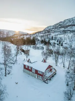 an aerial view of a house in the snow at Handeland Lodge Near Trolltunga and Pulpit Rock Sleeps 18 with Sauna in Sauda