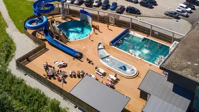 an overhead view of a pool with a water slide at Handeland Lodge Near Trolltunga and Pulpit Rock Sleeps 18 with Sauna in Sauda
