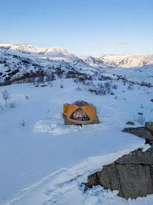 a tent in the snow in a snowy field at Handeland Lodge I Arctic Dome in Sauda