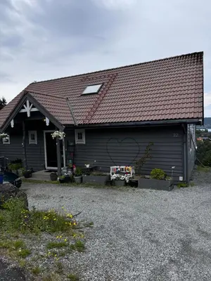 a house with a heart painted on the side of it at Villa with a view in Morviki