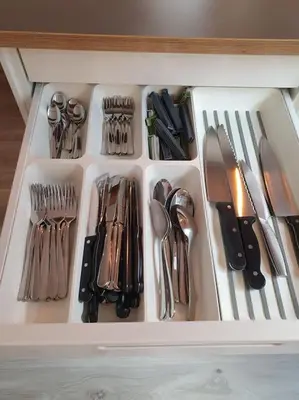 a drawer filled with lots of utensils in a drawer at Corner apartment with 2 bedrooms in the middle of the city centre in Trondheim