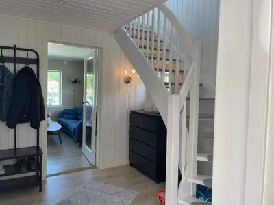 a room with a staircase leading to a bedroom at 6 person holiday home in BØMLO in Bømlo