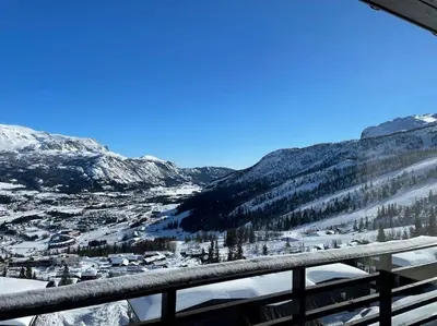 a view of a ski resort in the snow at Hemsedal, Ski in Ski out, Skarsnuten Panorama 55 in Tuv
