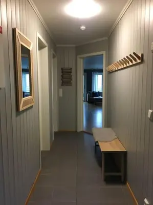 a hallway with a table and a bench in a room at Hemsedal, Ski in Ski out, Skarsnuten Panorama 55 in Tuv
