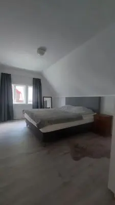 a bedroom with a bed in a room at Old Town House in Rjukan