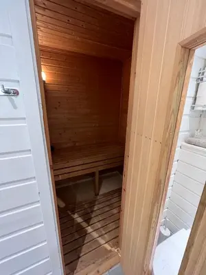 a walk in sauna in a tiny house at Cozy apt with a view in Beitostøl