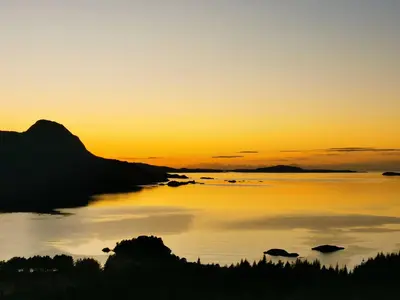 an image of a sunset over a body of water at Utsikten in Korsnes
