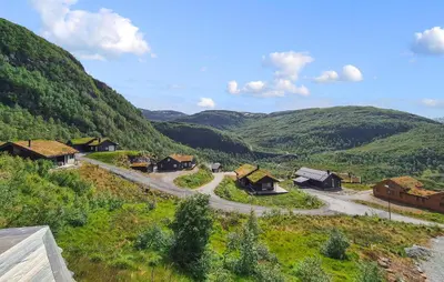 a view of a valley with houses in the mountains at Awesome Home In Norheimsund With Wifi in Norheimsund