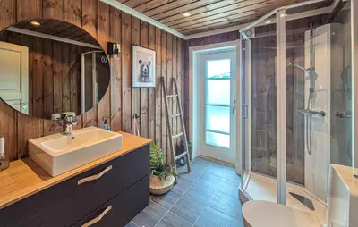 a bathroom with a sink and a shower at Awesome Home In Norheimsund With Wifi in Norheimsund
