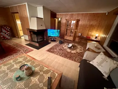 an aerial view of a living room with a fireplace at Trivelig leilighet med gratis parkering på stedet in Forset
