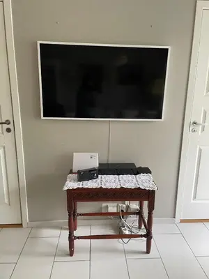 a table with a camera on it in a room at Flott leilighet in Bergen