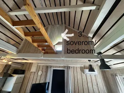 a sign hanging from the ceiling of a room at Koselig Sentrumsleilighet i 2 etg in Nes i Ådal