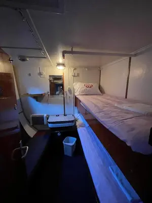a small room with two beds in it at Sunnhordland in Odda