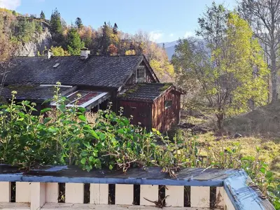 an old house in the middle of a field at 6 person holiday home in Åkra-By Traum in Kyrping