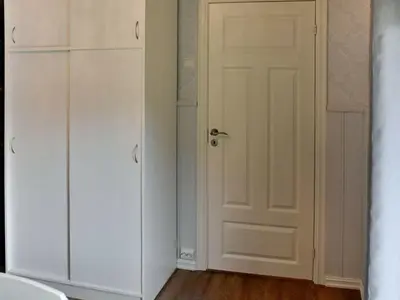 a room with white cabinets and a door at 4 person holiday home in Måndalen-By Traum in Sæbø