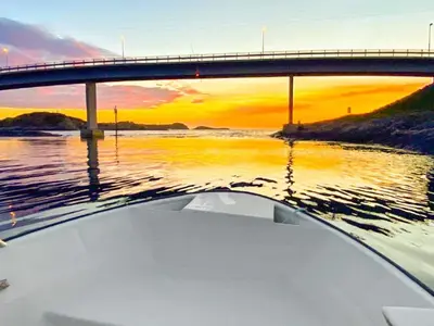 a boat in the water under a bridge at 10 person holiday home in VEVANG-By Traum in Vevang