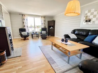 a living room with a couch and a coffee table at 10 person holiday home in VEVANG-By Traum in Vevang